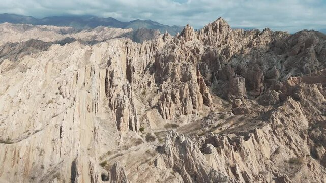 Amazing approaching aerial movement to the Quebrada de Las Flechas mountain ridge, Salta, Argentina, South America.