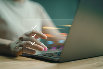 Business performance checklist, businessman using laptop doing online checklist survey, filling out digital form checklist, take an assessment, questionnaire, evaluation, online survey, online exam.
