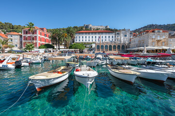 Hvar Island, Croatia. View of the old town with moored boats in the harbor. 