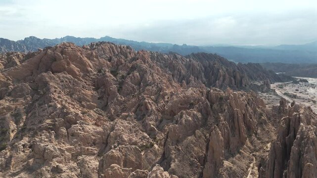 Close-up panning aerial movement about the Quebrada de Las Flechas mountain ridge, Salta, Argentina, South America.