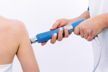Shock wave therapy session in progress, showcasing effective non-surgical muscle pain treatment. The therapy focuses on pain relief, muscle regeneration, and stimulating the healing process.