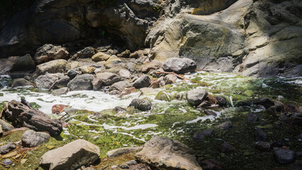 Beautiful view of rocky river flow nearest the Tumpak Sewu Waterfall in East Java, Indonesia