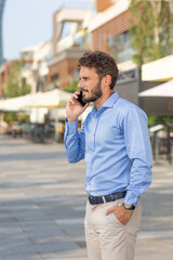 Businessman with beard talking on the smartphone