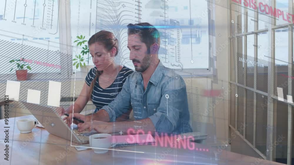 Poster scanning data animation over two people working on laptops in office