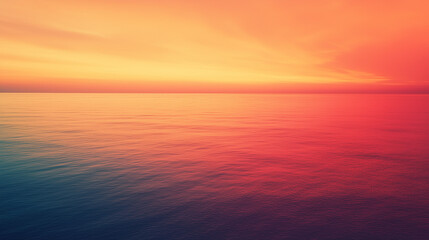 Serene ocean at sunset with vibrant sky, orange and red hues, peaceful background