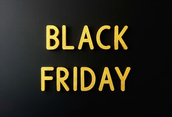 Black Friday text, yellow gold letters on black board