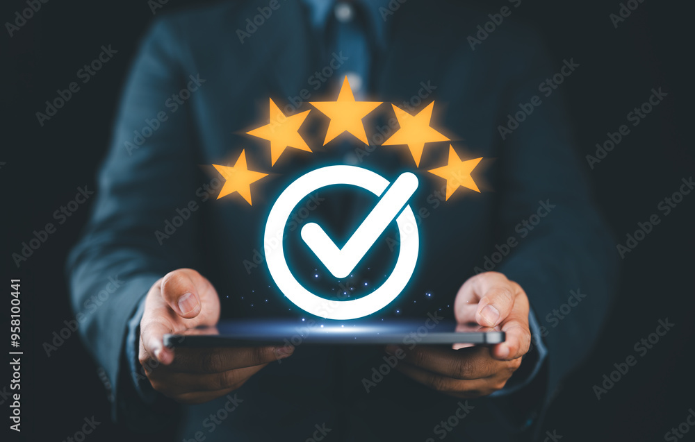 Poster businessman holding tablet and showing the best quality assurance with golden five stars for guarant