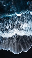 The image is a beautiful shot of the ocean with a wave cresting in the foreground. The water is a deep blue color, and the wave is white and crashing against the shore. Scene is serene and calming