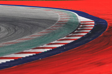Race track. A high-speed corner of race ring during the day.