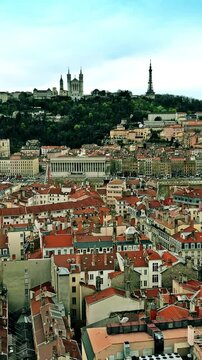 Aerial view of the centre and old town of Lyon and the metallic tower of Fourviere, France, vertical video