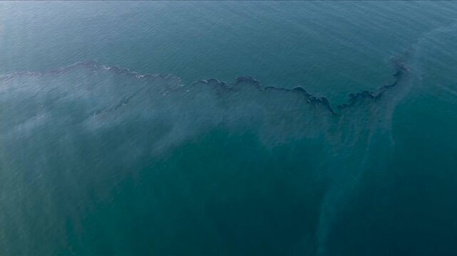 DRONE VIEW OF OIL SPILL IN THE OCEAN