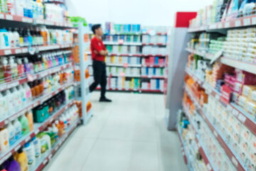 Books are neatly arranged on the cupboard shelf