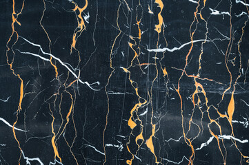 Blue marble with golden veins. The natural blue-golden texture of marble
