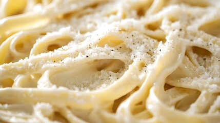 Creamy Fettuccine Alfredo with Parmesan Cheese - Delicious Italian Cuisine Close-Up Photo