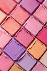 Fototapeta premium Paint Swatches, A vibrant collection of paint swatches in shades of pink, peach, and purple, organized in a grid format on a light background
