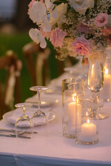 Dinner table decorated with beautiful flowers.