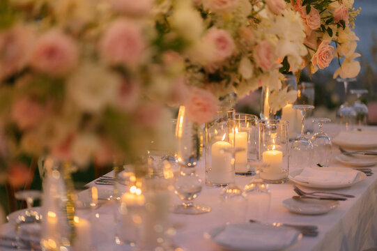 Dinner table decorated with beautiful flowers.