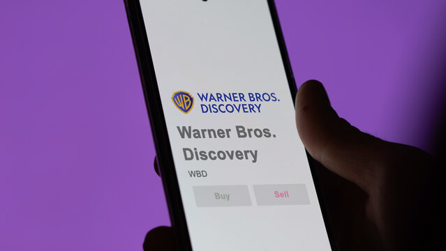 April 09th 2024 , New York City, New York. Close up on logo of Warner Bros. Discovery on the screen of an exchange. Warner Bros  Discovery price stocks, $WBD on a device.