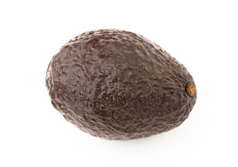 Ripe dark avocado on white background