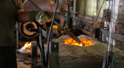 Foundry - ferrous metal is melted in an induction furnace of metallurgical plant