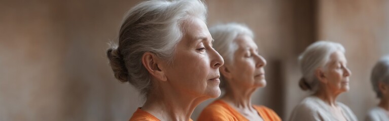 Serene Group of Elderly Women Meditating in Orange Shirts, One D