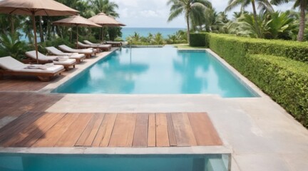 Fototapeta premium Tranquil outdoor pool surrounded by greenery and palm trees with