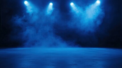 Naklejka premium A dramatic blue stage lighting setup with fog, creating an atmospheric effect perfect for performances or events.