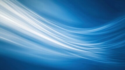 Fototapeta premium A serene blue background featuring gentle flowing lines, perfect for conveying calmness and tranquility in design projects.