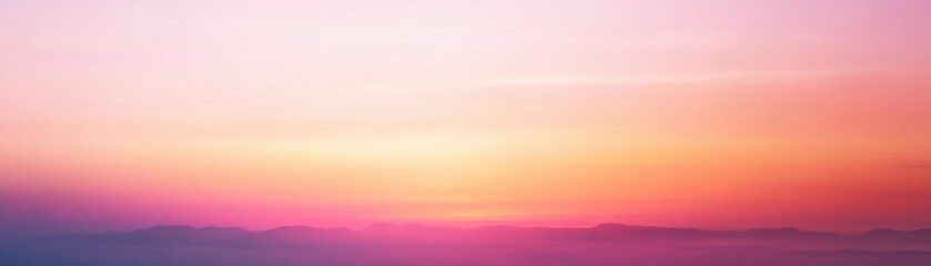 Obraz premium A serene gradient sky at sunrise, blending soft hues of pink, purple, and orange over a tranquil horizon.