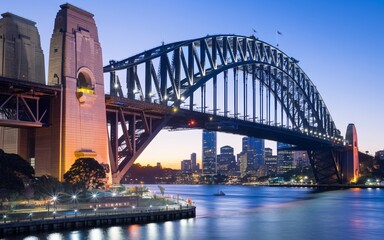 Sydney Harbour Bridge with City Skyline Sunrise Background
