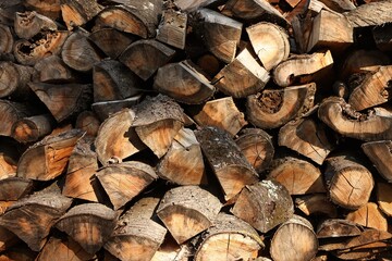 Pile of cut firewood as background, closeup