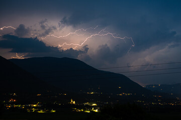 Nighttime lightning storm over the southern limestone Alps, north of Verona, Italy