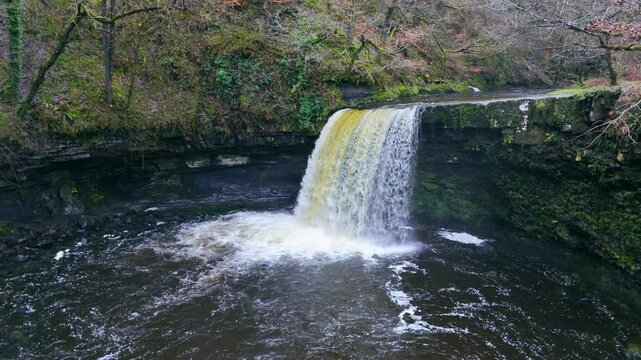 In a hidden vale where secrets hide, Sgwd Gwladys water flows with pride