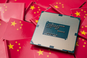 CPU computer (central processing unit) on many Chinese flag background. US vs China chip war or...