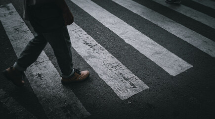 feet walking on the road when you want to cross a zebra crossing
