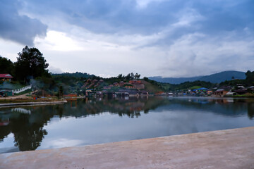 Fototapeta premium Old chinese style house in tea plantation at Ban Rak Thai the village is surrounded by mountain in Mae Hong Son, Thailand. A village of Chinese settlement is travel destination in Mae Hong Son