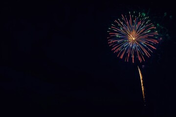 Fireworks on the dark sky background. Colorful fireworks from Loto Quebec in Quebec, Canada. Abstract colored firework background with free space for text. fireworks light up the night sky , ai