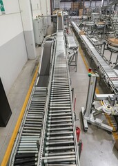 packing line in a logistics warehouse. conveyor belt in a modern production line