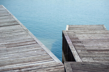 Fototapeta premium Modern wooden pier on the lake
