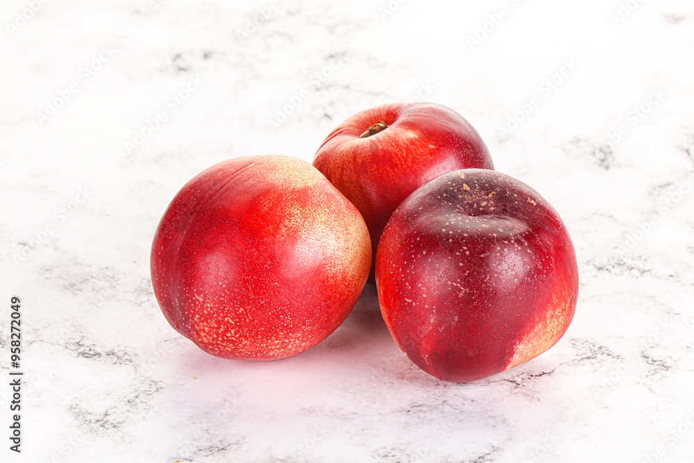 Wall mural Ripe sweet juicy nectarines heap