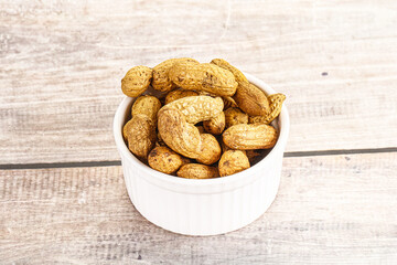 Raw ripe unpeeled peanut heap