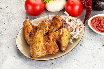 Grilled chicken wings with sauce