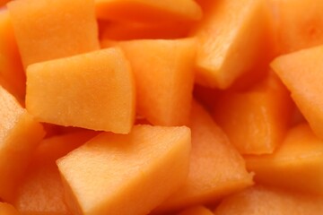 Pieces of Cantaloupe melon as background, top view