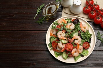 Delicious shrimp salad and ingredients on wooden table, top view. Space for text