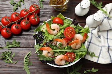 Delicious shrimp salad and ingredients on wooden table, flat lay