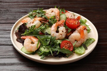 Delicious shrimp salad with vegetables on wooden table, closeup