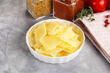 Sliced parmesan cheese in the bowl