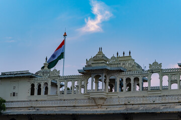 historical palace unique architecture with indian tricolor and bright blue sky at evening
