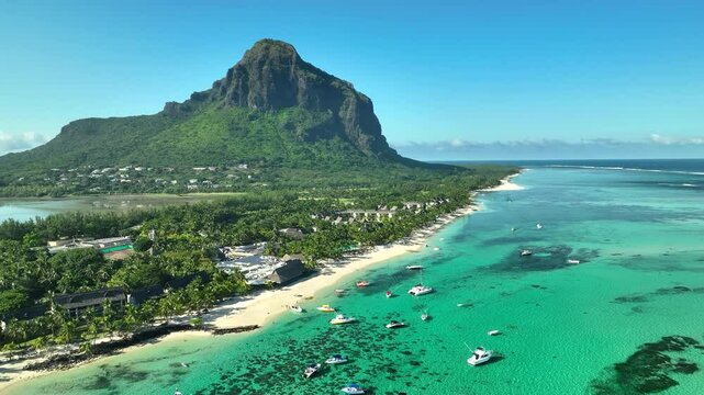 Aerial view: Luxury tropical beach, boats and Le Morne mountain in Mauritius
