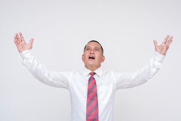 An ambitious and confident middle aged office male professional making grandiose claims, expressing limitless potential with both hands.Set against a white background.